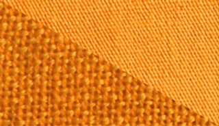 Fabric swatch dyed in golden yellow, demonstrating the vibrant color achieved with our fabric dye on different textures.